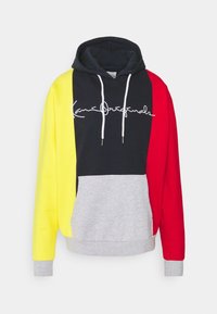 Sudadera con capucha de diseño en bloques de color en amarillo, negro, rojo y gris. Presenta cordones blancos y un logo frontal en cursiva.