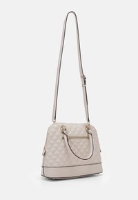 Quilted beige handbag with a zip closure, dual handles, adjustable shoulder strap, gold-tone hardware, and a front zip pocket.