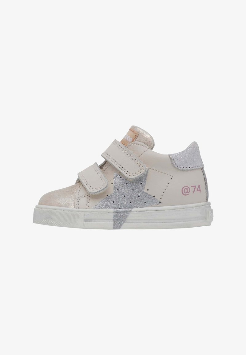 White leather sneaker with silver star accents, two Velcro straps, and a pink '@74' detail on the heel. Features a textured, rubber sole.