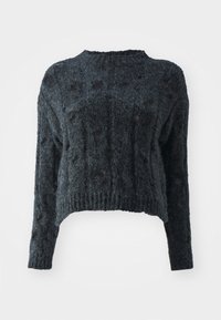 Pull en maille noire duveteuse avec manches longues et ourlet court, présentant un motif de maille ajourée subtil sur l'ensemble.