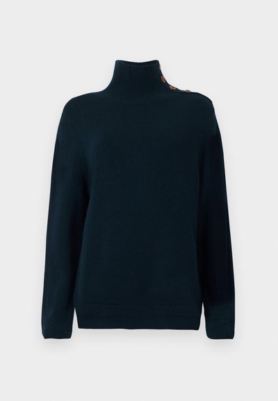 Donkerblauw coltrui gemaakt van zachte stof, met een ribbelkraag en schouderknopen voor detail. Relaxte pasvorm en lange mouwen.