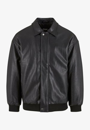 Must must jacket, mille kaela, ees näpu kinnitusega ja ribitud mansettidega. Sujuv tekstuur ja veidi lõdvem istuvus.