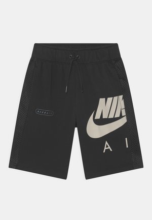 Shorts de sport noirs avec taille à cordon, panneaux latéraux en mesh et grand logo Nike gris clair sur le devant.