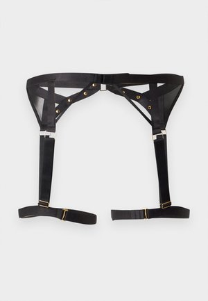Liguero ajustable negro con tachuelas metálicas doradas y deslizadores, con paneles de tejido translúcido y dos correas para el muslo desmontables.