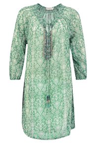 Lätt grön klänning med blommönster, samlad halsringning och långa ärmar. Har dekorativa detaljer fram.