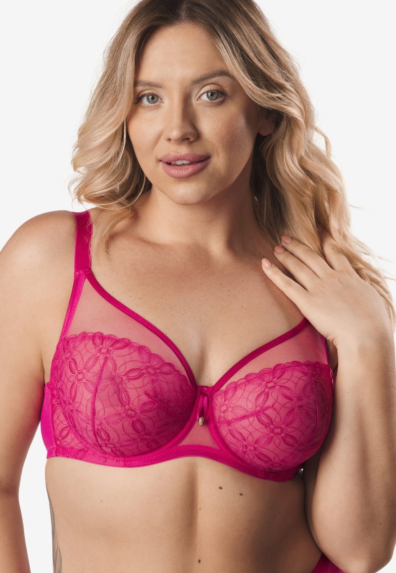 Fuksjowy stanik koronkowy z kwiatowym wykończeniem, w fasonie balconette, z cienkimi regulowanymi ramiączkami i małą ozdobną kokardką na środku.