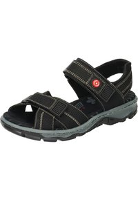 Svarta sandaler med texturerad syntetisk ovandel, justerbara kardborreband, gummisula och kontrasterande ljus sömnad; lämpliga för vardagsbruk.