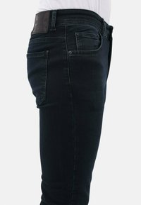 Jeans Tapered Fit - donker blauw