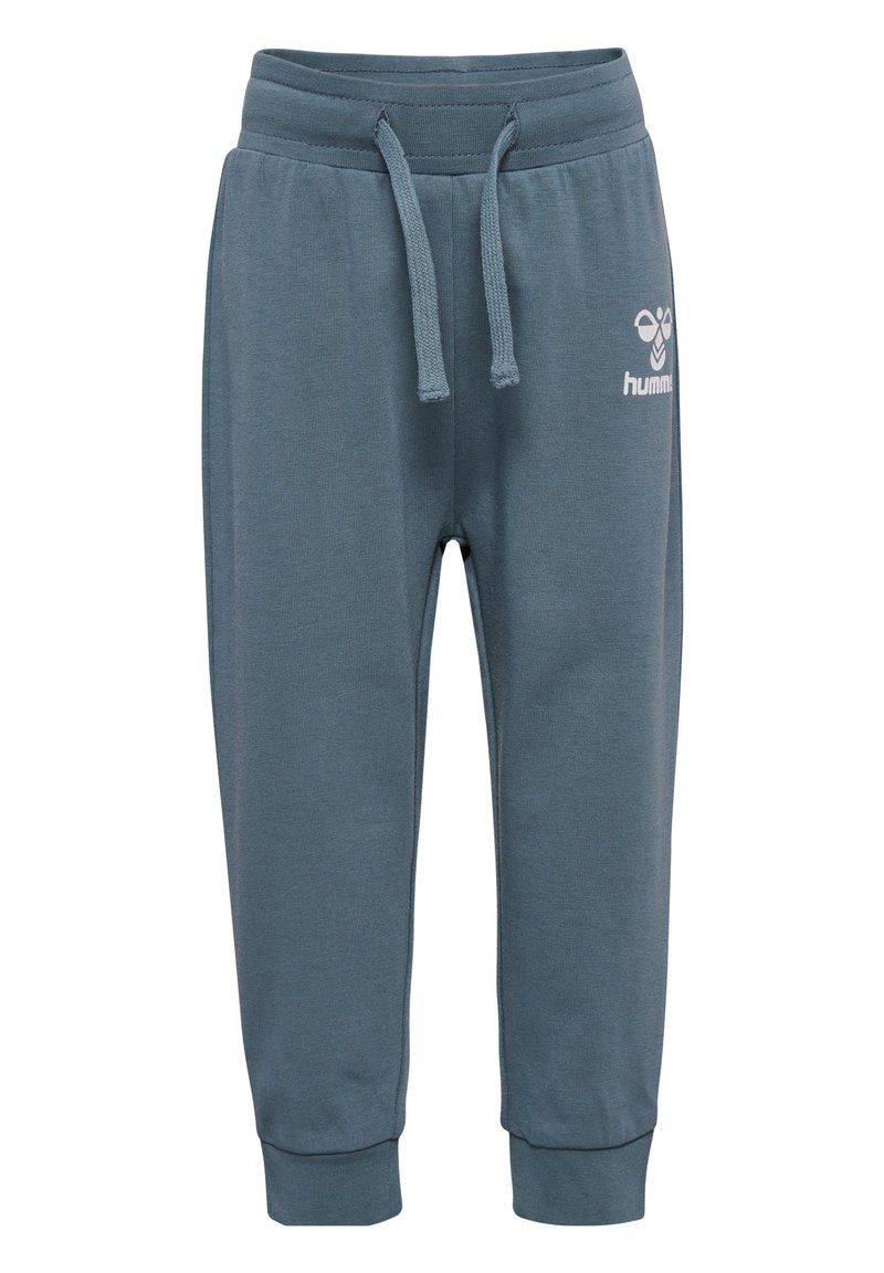 Blauwe katoenen joggers met een elastische tailleband en verstelbaar trekkoord. Manchetten bij de enkels en een klein wit logo aan de voorkant.