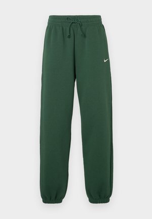 Dunkelgrüne Sweatpants aus weichem Stoff, mit elastischem Bund und Kordelzug sowie zulaufenden Bündchen. Kleines weißes Logo auf der Vorderseite.
