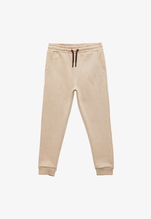 Beige Jogginghosen aus weichem Stoff, mit einem elastischen Bund und einem braunen Kordelzug sowie Seitentaschen. Fitted Bündchen an den Knöcheln.