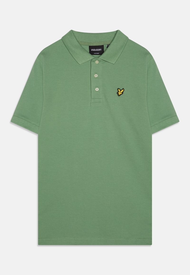 Grønn polo skjorte laget av bomull, med en placket med tre knapper og en gul brodert fuglelogo på venstre bryst. Korte ermer.