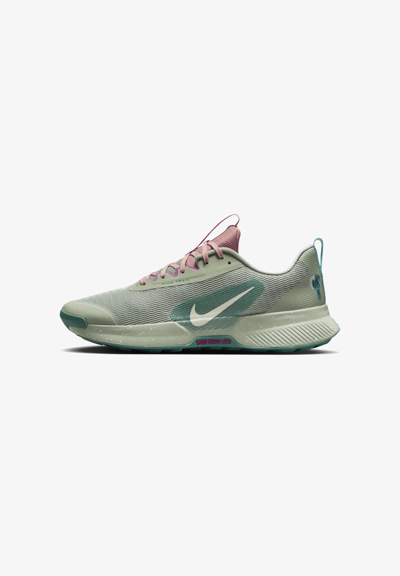 Nike Trail running shoe features a light green mesh upper, purple accents, and a textured sole with a speckled design.