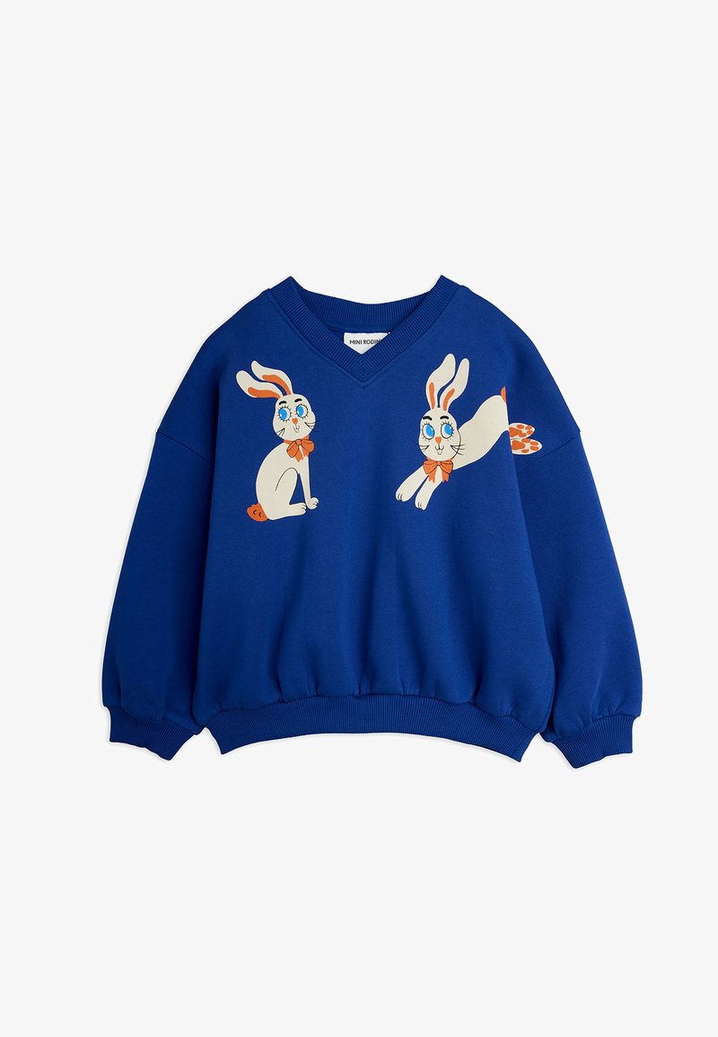 Pull bleu pour enfants avec col en V et lapins blancs dessinés animés avec nœuds papillons orange imprimés sur le devant.