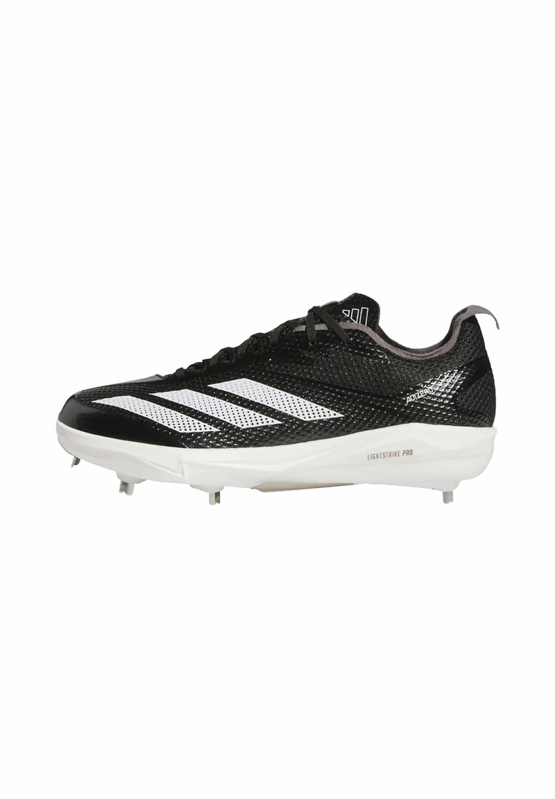 Black and white athletic cleat with a mesh upper, featuring three white stripes, a white sole, and screw-in studs for traction.