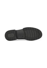 Semelle de chaussure en caoutchouc noir avec des motifs de grip texturés, de forme courbée et un texte en relief. Présente une section centrale lisse et des bords surélevés.