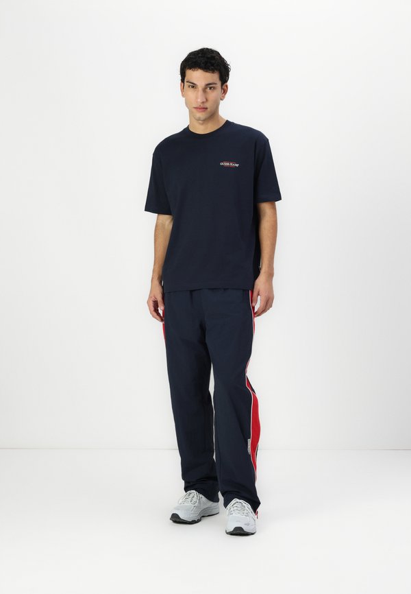 WINDBRAKER PANT - Tracksuit bottoms - daring ocean3