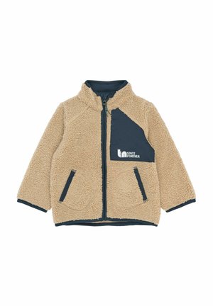 Barna plüssdzseki magas gallérral, tengerészkék kiegészítőkkel. Cipzáras zárás, két elülső zseb és logo a mellrészen. Puha tapintású.