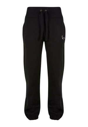 Svarte joggebukser laget av mykt stoff med elastisk midjebånd, snøring og elastiske mansjetter. Har en liten hvit logo på siden.