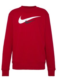 Červená mikina vyrobená z bavlny, s kulatým výstřihem, dlouhými rukávy a výrazným bílým a černým logem Nike na přední straně.