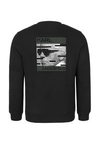 Sudadera negra con mangas largas, puños y dobladillo acanalados. La parte posterior presenta un diseño impreso con las etiquetas "KARL" y "LAGERFELD".