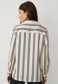 Ellos Collection Overhemdblouse - cremefarbener schwarzer streifen