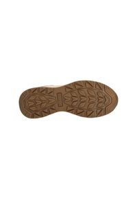 Semelle de chaussure en caoutchouc brun avec une surface texturée présentant des motifs de traction proéminents et le nom de la marque "Whistler" embossé au centre.