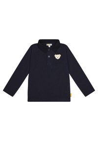 Marineblauwe polo met lange mouwen en kraag, voorzien van een geborduurd berenpatch op de borst en een klein geel label aan de zijkant.