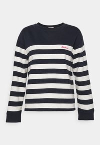 Pruhovaná dlouhá rukávová košile v námořnické modré a bílé barvě z bavlny, s kulatým výstřihem a žebrovanými manžetami. Malé červené logo na hrudi.