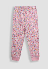 Violet pitkät housut, joissa on kokonaan kukkakuosi ja yksisarvisprintti. Joustava vyötärönauha ja kuminauhalla varustetut nilkat pehmeässä kankaassa.