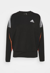 Sweatshirt noir à manches longues, ourlet côtelé, logo Adidas sur le devant, rayures blanches sur les épaules et accents en mesh orange sur les côtés.