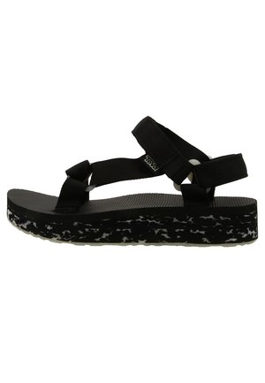 Sort platformsandal med justerbare remme og tekstureret sål med hvidt og gråt marmoreret mønster.