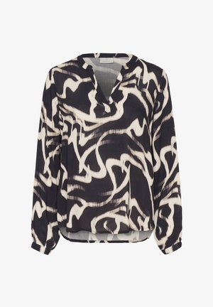 Blusa en blanco y negro con escote en V, mangas largas y un patrón de espirales abstractas. Confeccionada en una tela ligera y con un corte relajado.