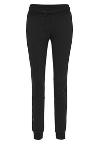 Svarta joggingbyxor med dragsko i midjan, smal passform och ribbade fållar. Sidofickor och subtila mönstrade detaljer på underbenen.