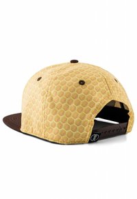 Snapback kork, millel on kollane mesiibeelimise muster, pruun kivis ja aksent. Omab õmmeldud detaile ja reguleeritavat rihma taga.