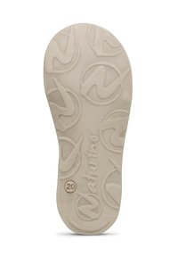 Krémová gumová podrážka s texturovaným vzorem, která obsahuje opakující se logo a číslo "20" vyražené poblíž okraje. Hladký povrch.