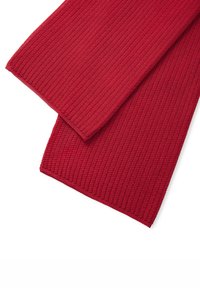Pezzetti di tessuto rosso e rigato piegati con una superficie testurizzata. I bordi sono rifiniti in modo ordinato, mostrando un motivo coerente e un colore vivace.