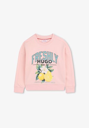 Sweat-shirt rose avec le texte « FRESHLY HUGO EST. 93 », un graphisme citron avec feuilles et fleurs, et le slogan « JUICY DAYS, HUGO WAYS ».