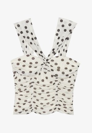 Kogutatud ülaosa laiade, langevate rihmadega. Omab suured pruunid täpid kreemival taustal. Sõlm üksikasjad keskel ees.