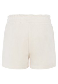 Fleece shorts vaaleassa beigeissä värissä, joissa on joustava vyötärö. Sileä pinta ilman näkyviä taskuja tai koristeluja.