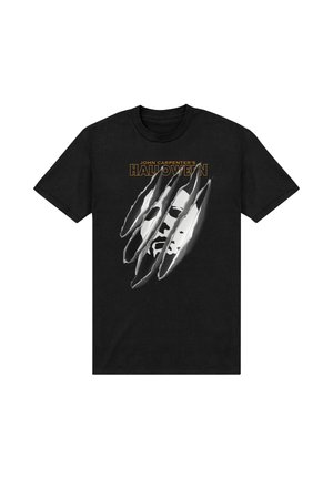T-shirt in cotone nero con una grafica di un volto dietro segni di artigli, con il testo "John Carpenter's HALLOWEEN" in giallo sopra.