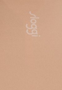 Light peach colored fabric with a ribbed texture and a prominent white "sloggi" logo printed on the surface.