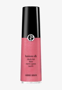 Rosa kinnrødme i en slank, mørk sylinderflaske med glossy svart hette og sølvlogo. Har produktnavn og detaljer i svart tekst.