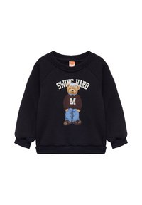 Sudadera negra de manga larga. Presenta un gráfico de un oso vistiendo un suéter, con el texto "SWING HARD" encima. Textura suave, puños acanalados.