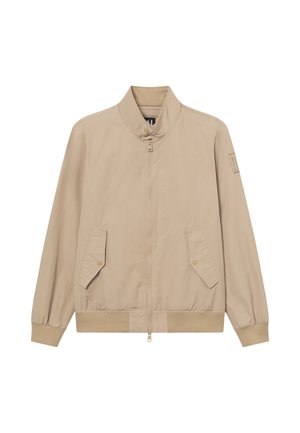 Beżowa bomberka na zamek z kołnierzem typu stójka, patkami z zatrzaskami, elastycznymi mankietami oraz naszywką z logo na lewym rękawie.