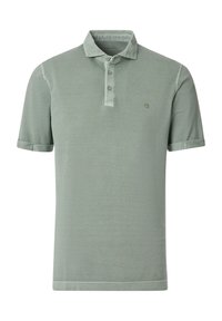 Light green short-sleeve polo shirt made from soft fabric features a collar and three-button placket with a subtle logo on the chest.