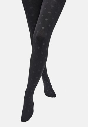 Medias negras con lunares, de textura suave, con un diseño semitranslúcido y grandes patrones circulares dispuestos de manera uniforme.