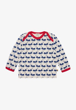 Langarmhemd aus cremefarbener Baumwolle mit rotem Kragen und Bündchen; weist ein wiederkehrendes blaues Ameisenmuster über den Stoff auf.