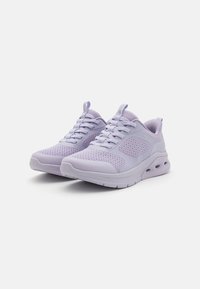Light purple athletic shoes with a breathable mesh upper, padded collar, and thick white sole with air cushioning for comfort.