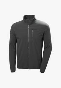 Chaqueta softshell negra de manga larga con cremallera completa en el frente, bolsillo en el pecho con cremallera y cuello alto, mostrada sobre un fondo blanco.